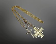 A yellow metal chain with pendant indistinctly stamped Jerusalem 14K, with crucifix pendant, 4.