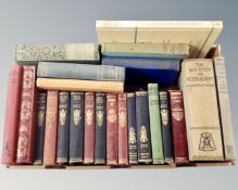 A box containing vintage books including Charles Dickens, Charles Kingsley, W. M.