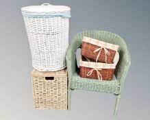 A painted basket chair together with four assorted wicker baskets.