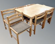 A 1970's dining table together with six chairs