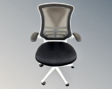 An office armchair upholstered in a black mesh fabric (white)