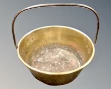 An antique brass cast iron-handled jam pan