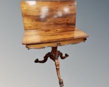 A 19th century rosewood turnover top tea table.