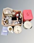 A box containing Metamech quartz wall clock, silver plated, cutlery, painted wooden spice rack,