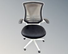 An office armchair upholstered in a black mesh fabric (white)