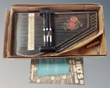 A boxed West German autoharp together with a song book.
