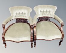 A pair of mahogany open tub chairs upholstered in a green dralon.