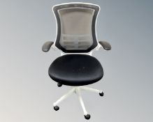 An office armchair upholstered in a black mesh fabric (white)