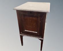 An Edwardian mahogany cabinet on raised legs