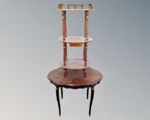 A shaped occasional table together with a three tier what-not stand