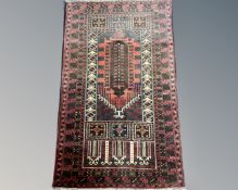 An Old Baluchi rug, 136cm by 83cm.