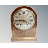 An Edwardian mahogany satinwood inlaid 8 day mantel clock with silvered dial