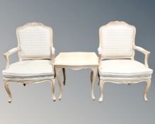 A pair of French style open salon armchairs with matching coffee table in a washed pine finish