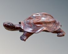 A Japanese carved and stained wood tortoise, length 15cm.