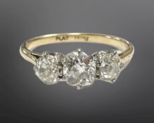 An 18ct gold and platinum three-stone old-cut diamond ring,