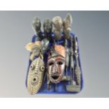 A group of African wood carvings including masks and figures etc.