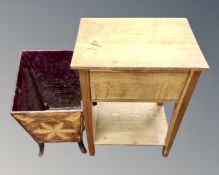 A carved wooden bin and an oak sewing table on stand