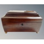 A George III mahogany tea caddy.