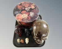 A tray containing ceramics skull ornament and further skulls, vintage hat box etc.