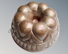 A circular copper jelly mould.