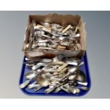 A tray containing a large quantity of loose plated cutlery.