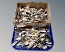 A tray containing a large quantity of loose plated cutlery.