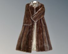 A lady's full length brown mink fur coat.