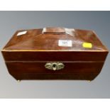 An early 19th century mahogany sarcophagus tea caddy.