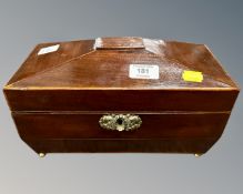 An early 19th century mahogany sarcophagus tea caddy.
