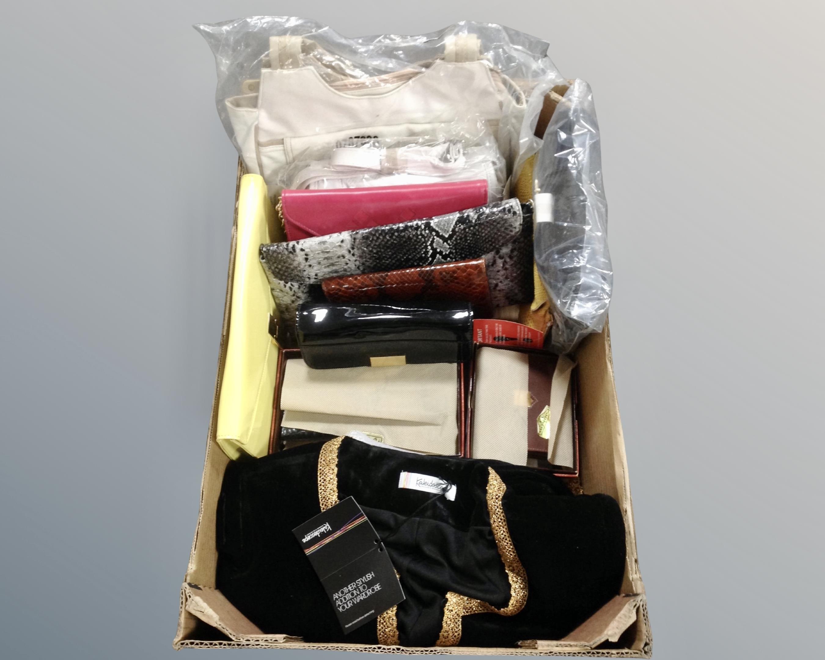 A box containing lady's handbags, Mondini leather wallets, lady's clothing etc.