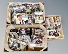 Three boxes of Newcastle United football programmes.