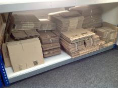 A very large quantity of flat packed cardboard boxes.