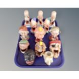 A tray containing continental ceramic grotesque figures.