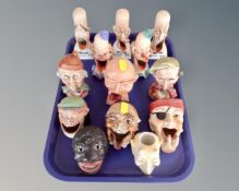A tray containing continental ceramic grotesque figures.