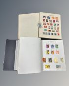 A Globe Super Stamp Album containing a collection of world stamps,