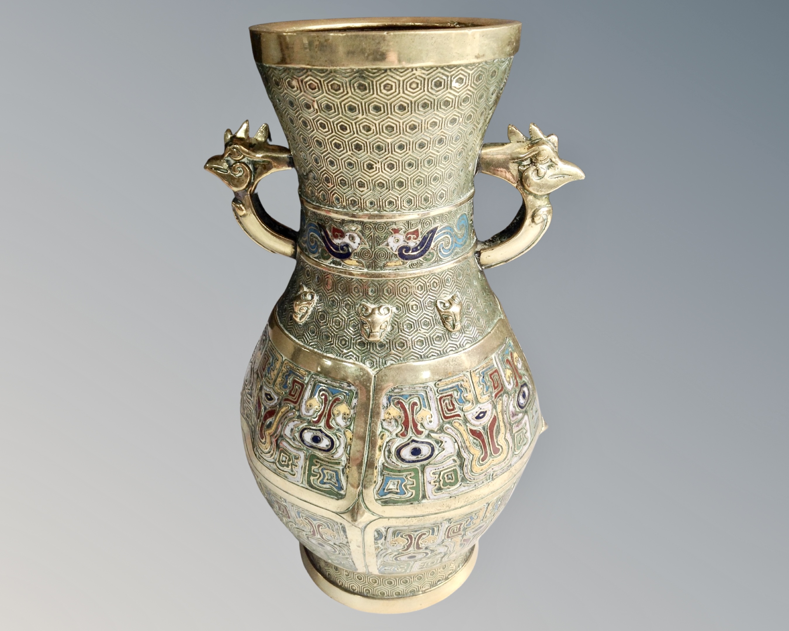 A Chinese brass and cloisonne enamel twin handled vase.