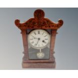 A late Victorian mantel clock with painted dial.