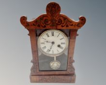 A late Victorian mantel clock with painted dial.