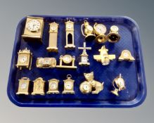 A quantity of brass miniature time pieces.
