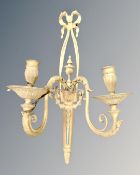 A brass twin branch wall sconce.