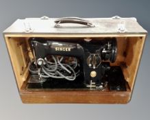 A vintage Singer 201k electric sewing machine in box.