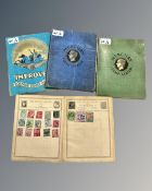 The Rowland Hill Postage Stamp Album containing a collection of world stamps,