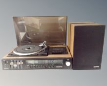 A Sanyo JXT 4406KL turntable together with a pair of teak cased speakers.