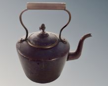 A Victorian copper kettle.