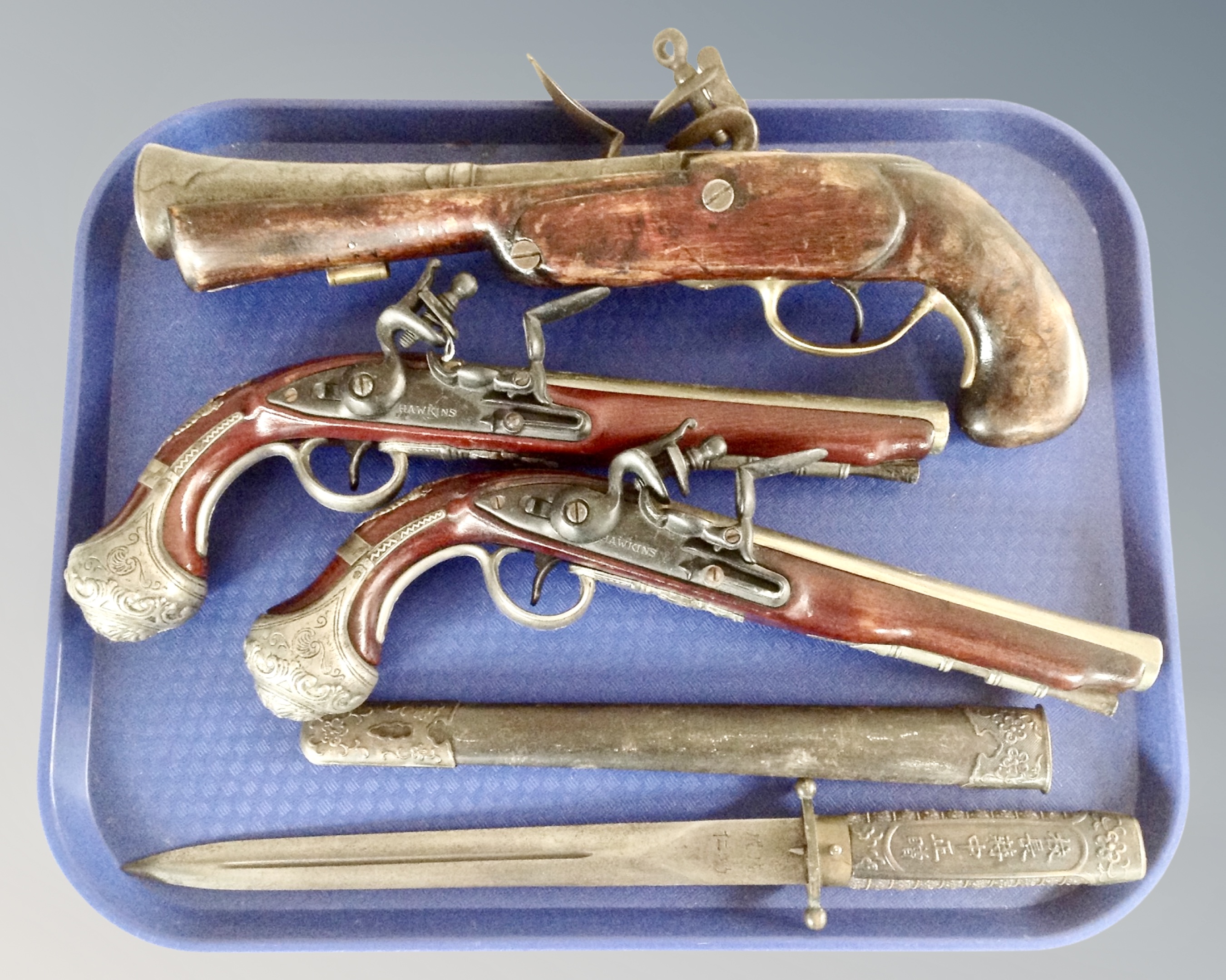 A pair of reproduction flintlock style pistols,