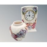 A Moorcroft pottery mantel timepiece (height 16cm),