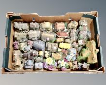 A box containing a collection of cottage ornaments including Academy, Danbury mint,