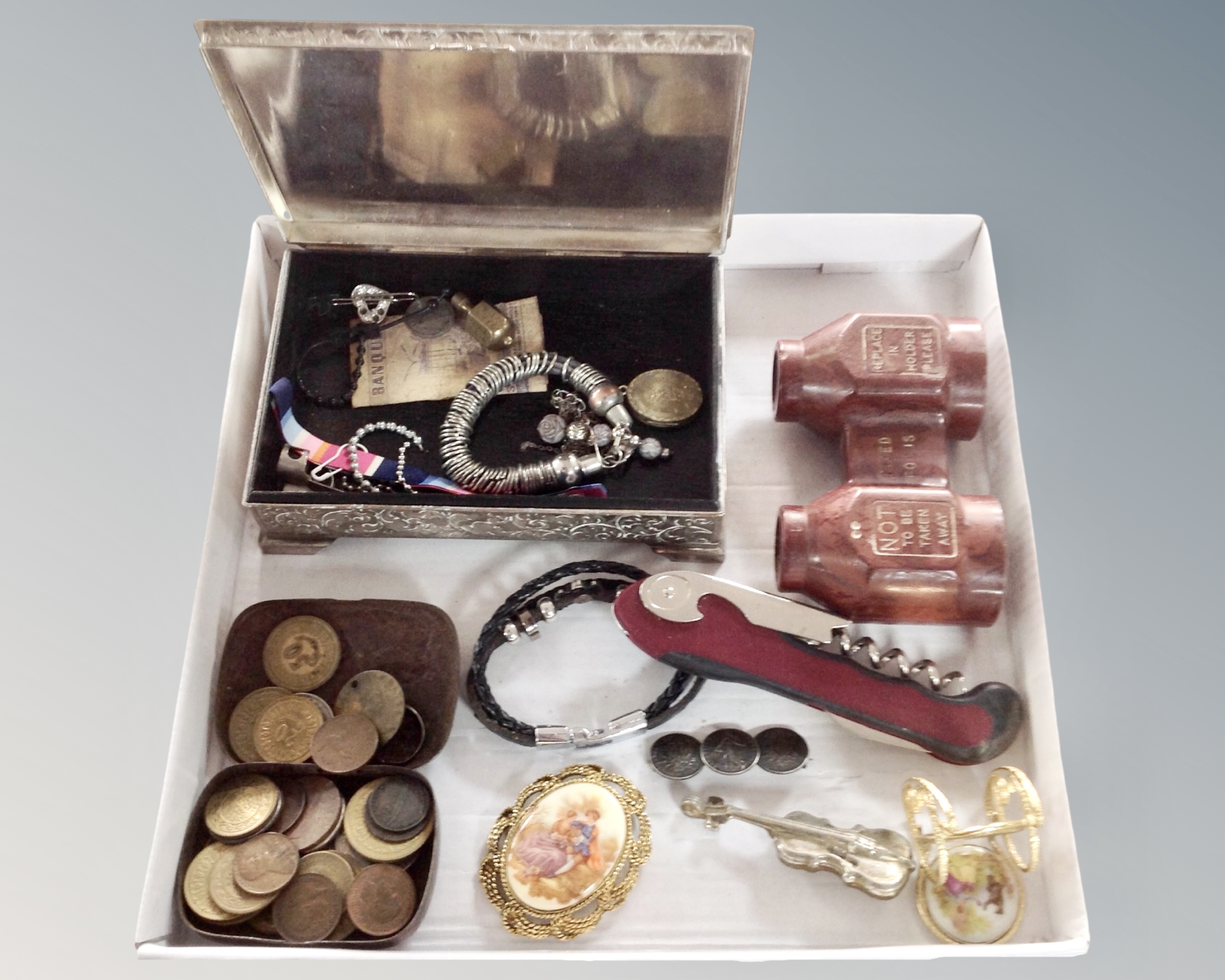 A plated trinket box containing a small quantity of costume jewellery, vintage coins, binoculars,