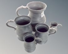 A graduated set of five pewter tankards.