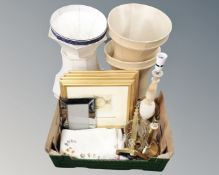 A box containing brass and onyx table lamps, linen, a set of four gilt frame prints.